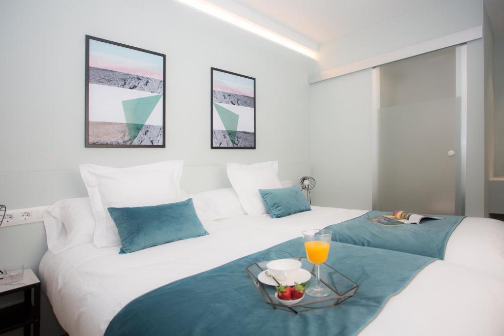 Posteľ alebo postele v izbe v ubytovaní Palacios Rooms