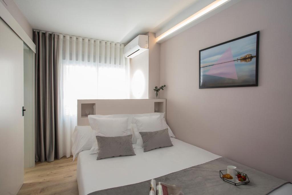 Posteľ alebo postele v izbe v ubytovaní Palacios Rooms