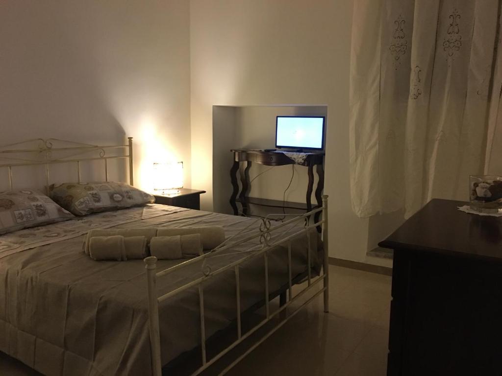 Postel nebo postele na pokoji v ubytování B&B Domus Gaetani