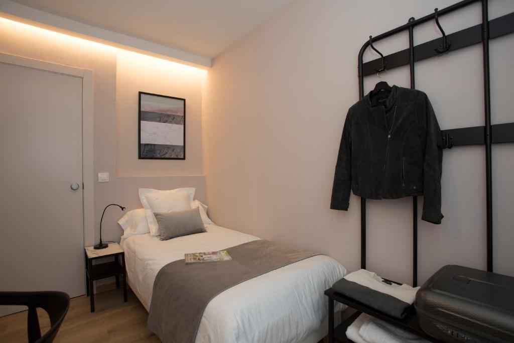 Posteľ alebo postele v izbe v ubytovaní Palacios Rooms