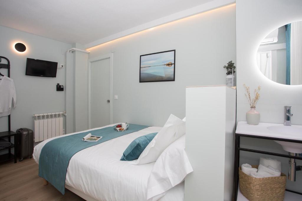 Posteľ alebo postele v izbe v ubytovaní Palacios Rooms