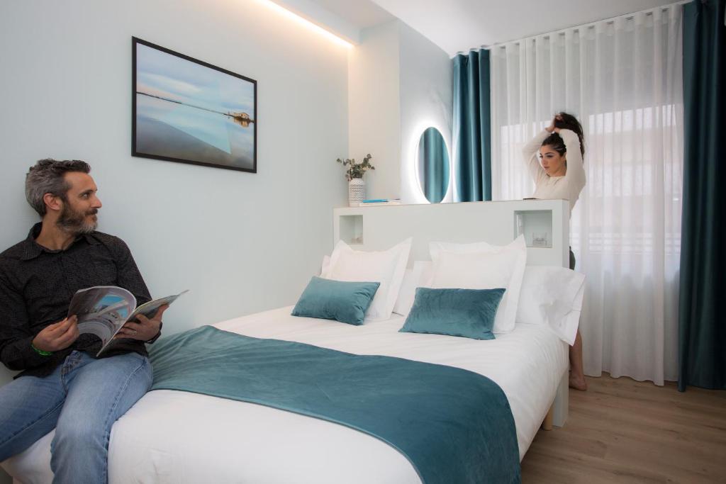 Posteľ alebo postele v izbe v ubytovaní Palacios Rooms