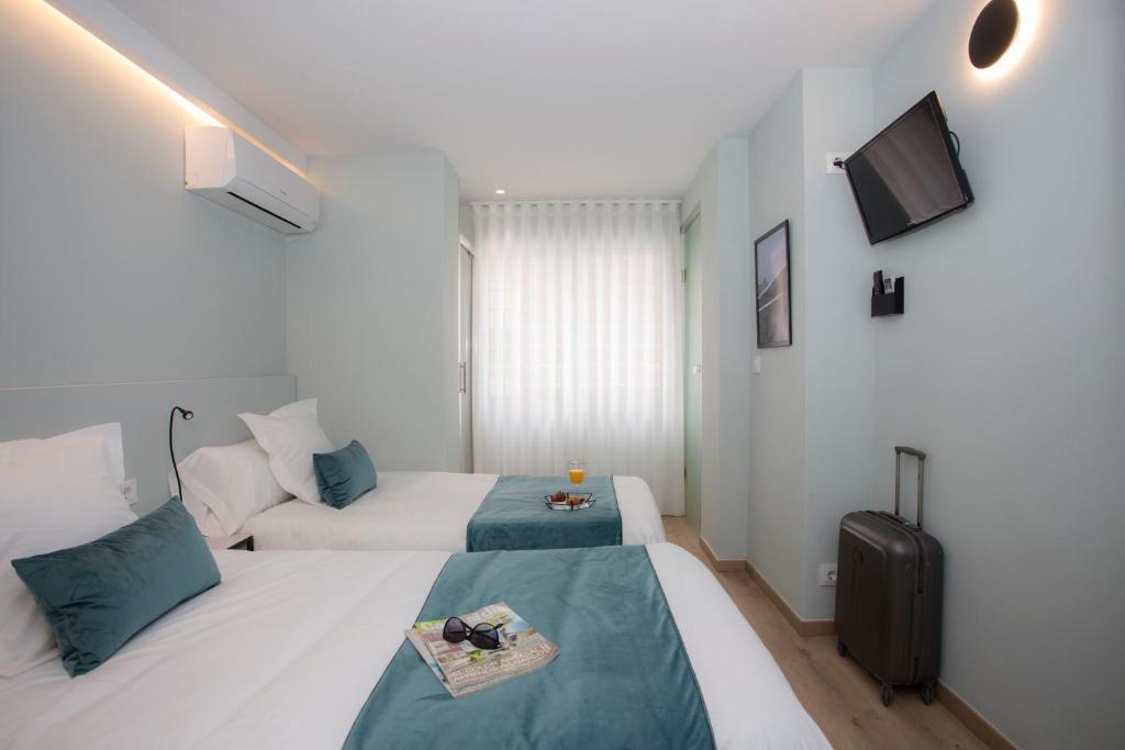 Posteľ alebo postele v izbe v ubytovaní Palacios Rooms