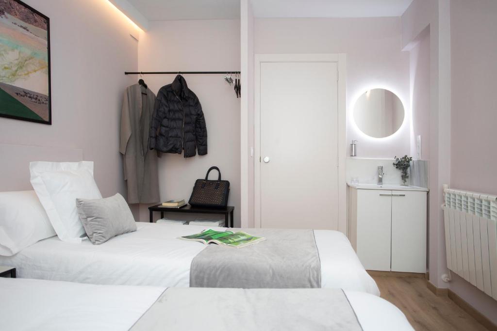 Posteľ alebo postele v izbe v ubytovaní Palacios Rooms