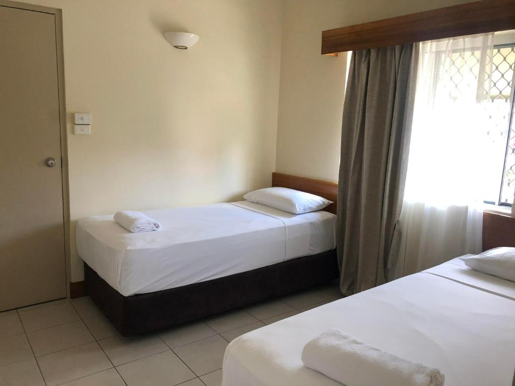 Postel nebo postele na pokoji v ubytování Tropical Queenslander