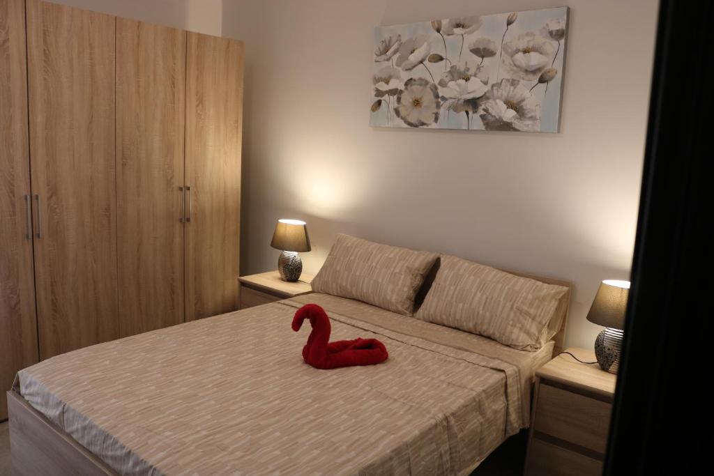 Postel nebo postele na pokoji v ubytování Seaside Apartments