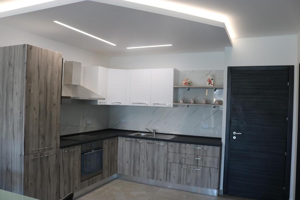 Kuchyň nebo kuchyňský kout v ubytování Seaside Apartments