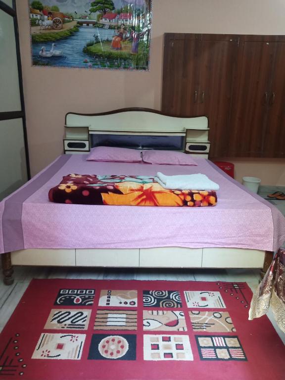 Postel nebo postele na pokoji v ubytování Sunita homestay