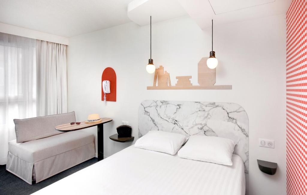 Postel nebo postele na pokoji v ubytování Hôtel ibis Styles Vichy Centre