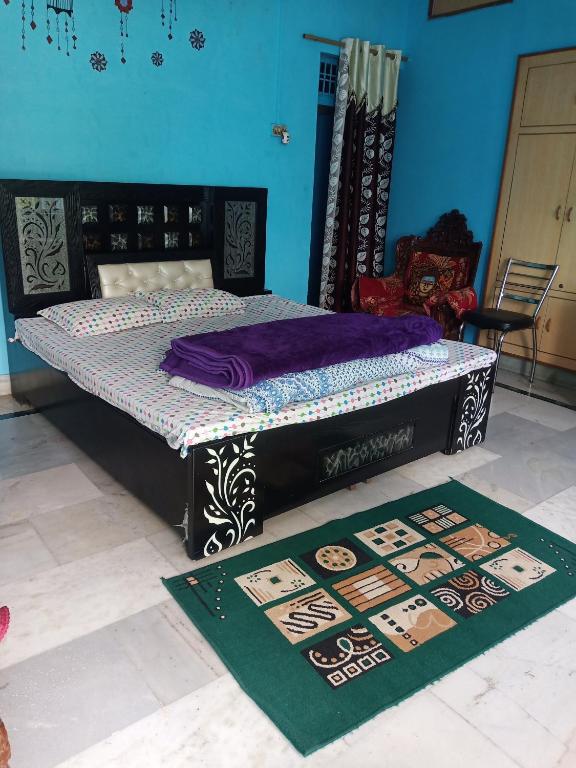 Postel nebo postele na pokoji v ubytování Sunita homestay