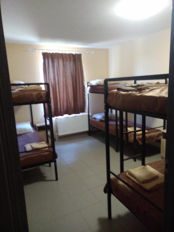 Postel nebo postele na pokoji v ubytování Mini gostinitsa HOSTEL