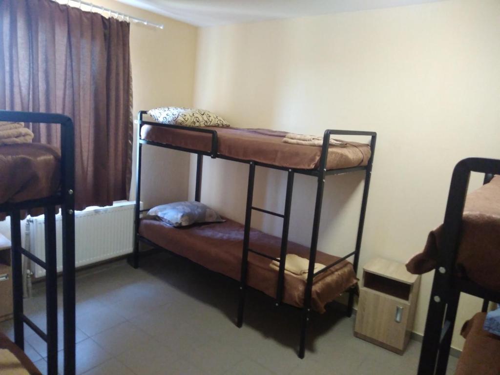 Postel nebo postele na pokoji v ubytování Mini gostinitsa HOSTEL