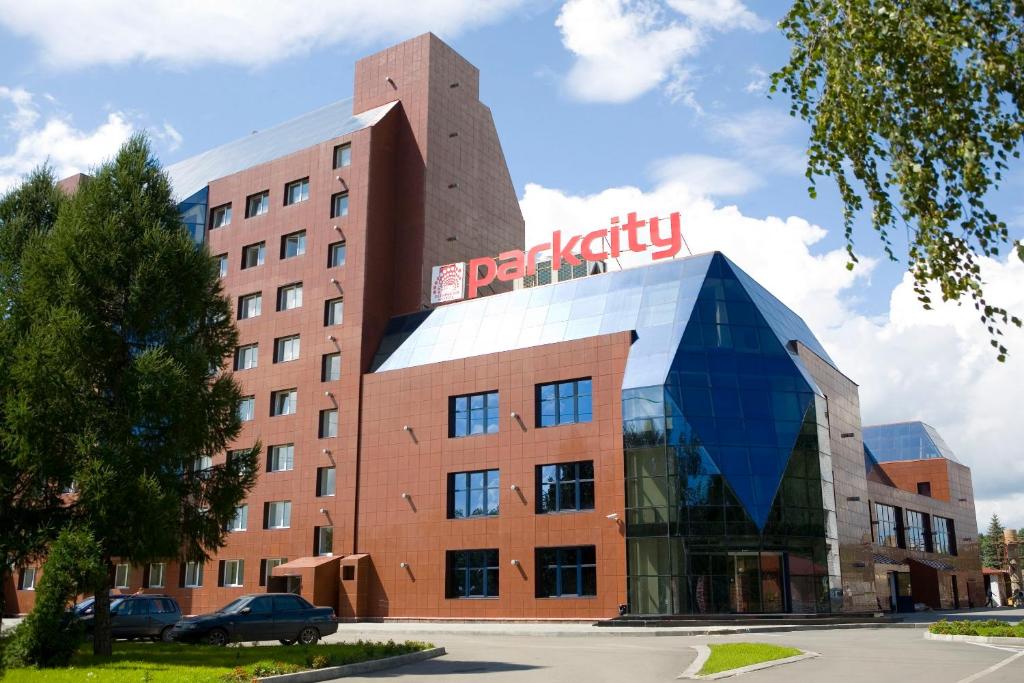 a building with a sign on top of it at ParkCity Hotel in Chelyabinsk