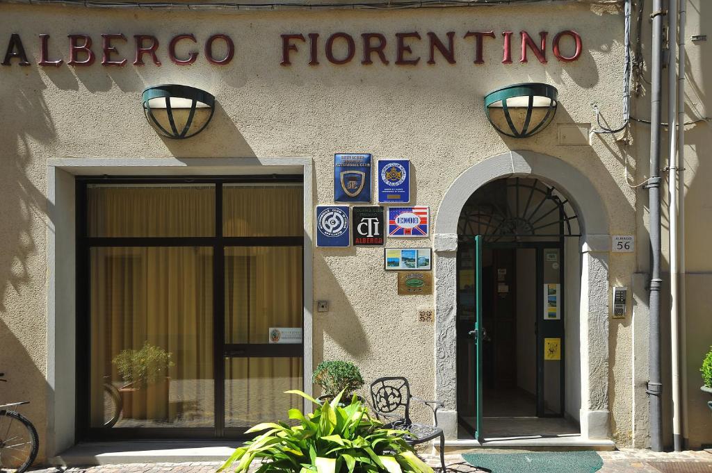 a building with a sign that reads albergo florence at albergo Fiorentino in Sansepolcro
