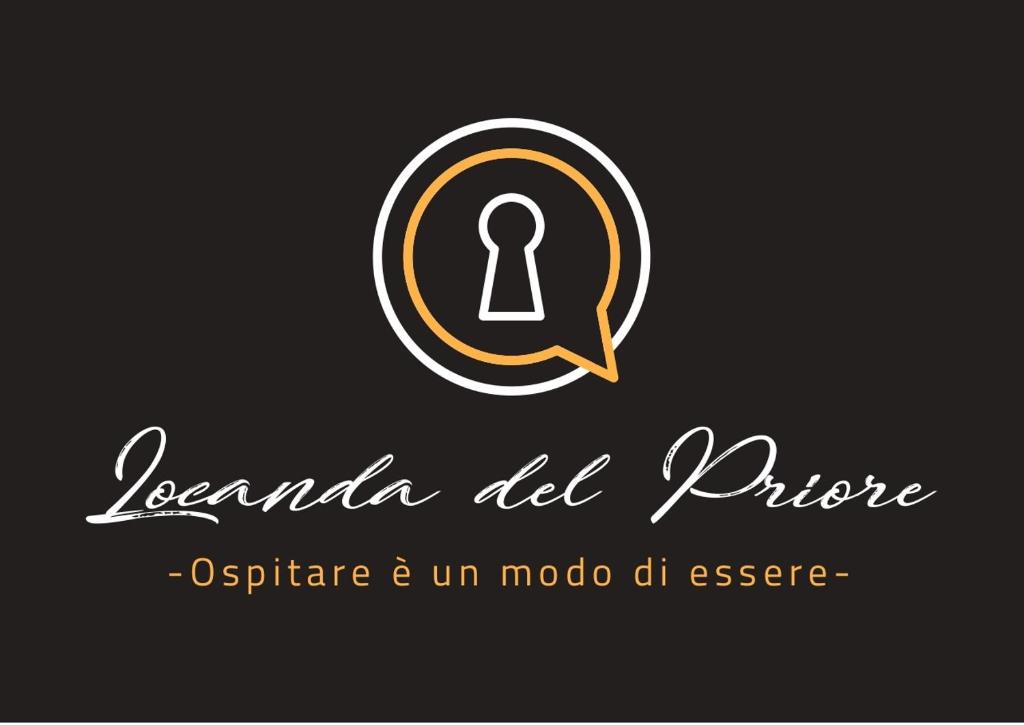 a logo for a music store with a keyhole at La Locanda del Priore in Vale