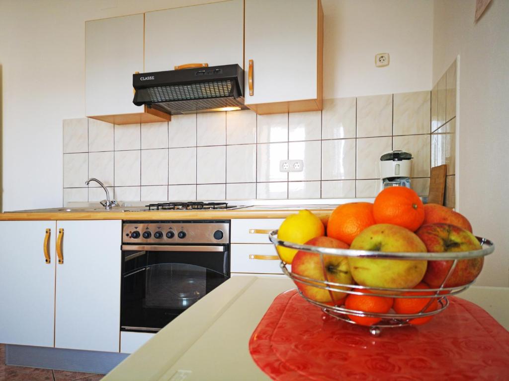 Kuchyň nebo kuchyňský kout v ubytování LiLu Apartments