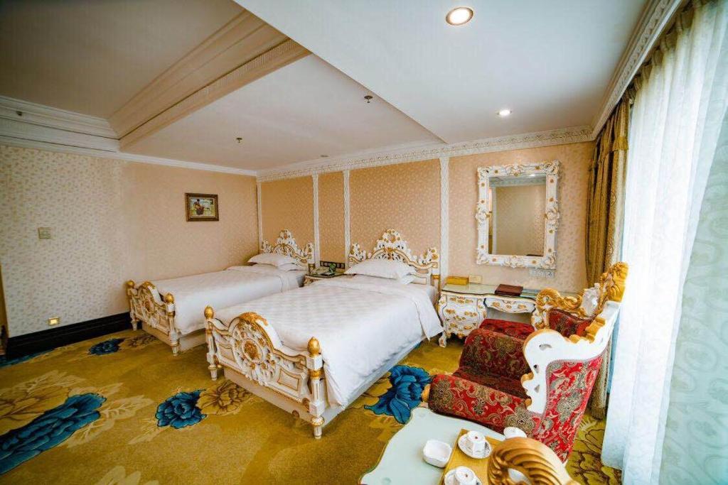 Postel nebo postele na pokoji v ubytování Nanyang King's Gate Hotel--Free Shuttle Service to Canton Fair