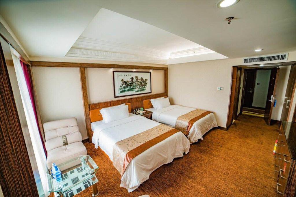 Postel nebo postele na pokoji v ubytování Nanyang King's Gate Hotel--Free Shuttle Service to Canton Fair
