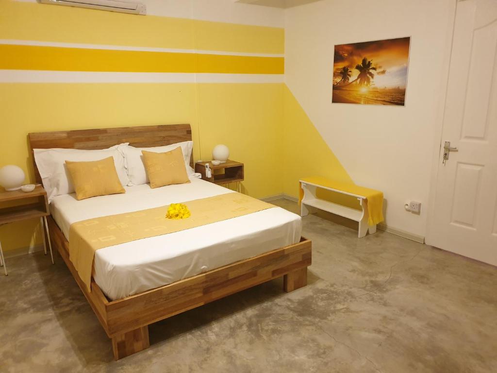 Postel nebo postele na pokoji v ubytování Casa Frangipani Mauritius