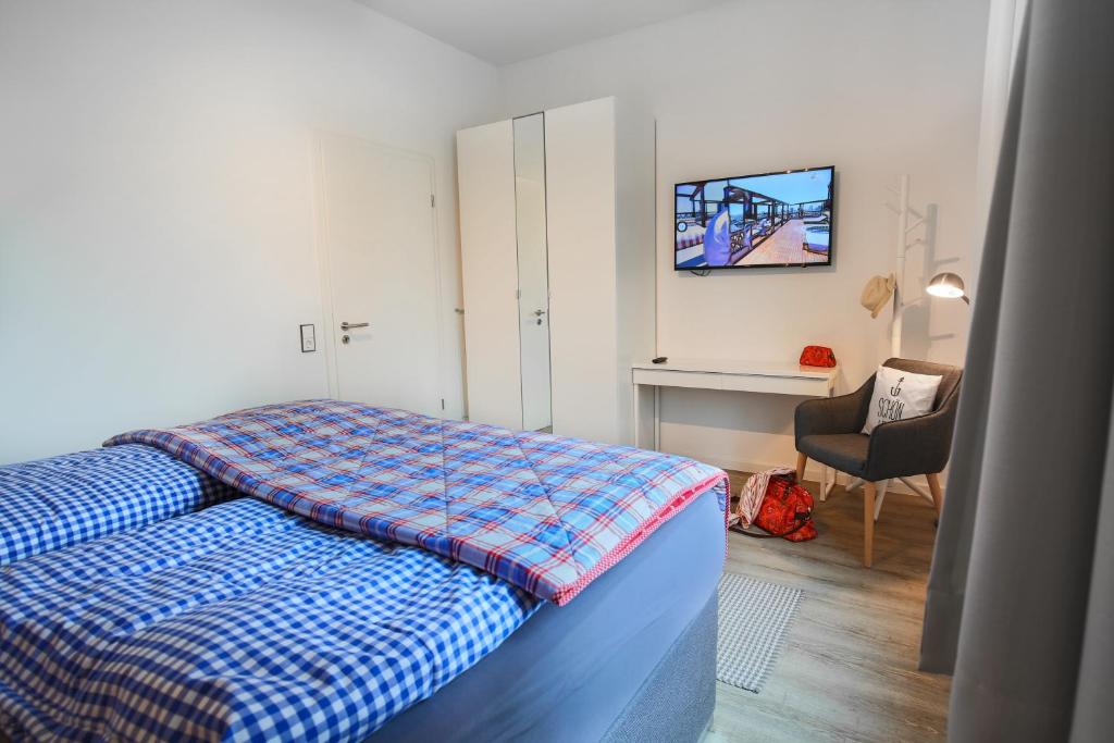Postel nebo postele na pokoji v ubytování Appartements Villa Schwanenteich