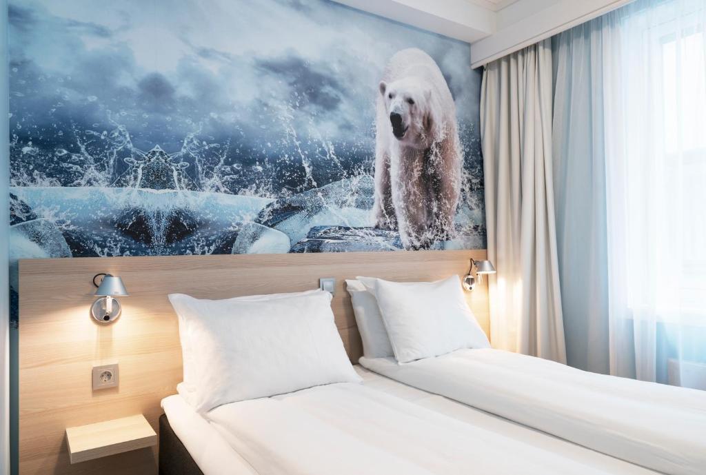 a hotel room with a polar bear painting on the wall at Thon Hotel Polar in Tromsø