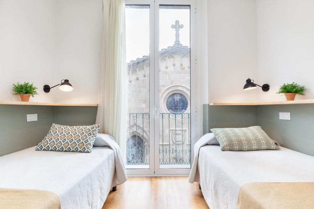 Postel nebo postele na pokoji v ubytování Hostal Fernando