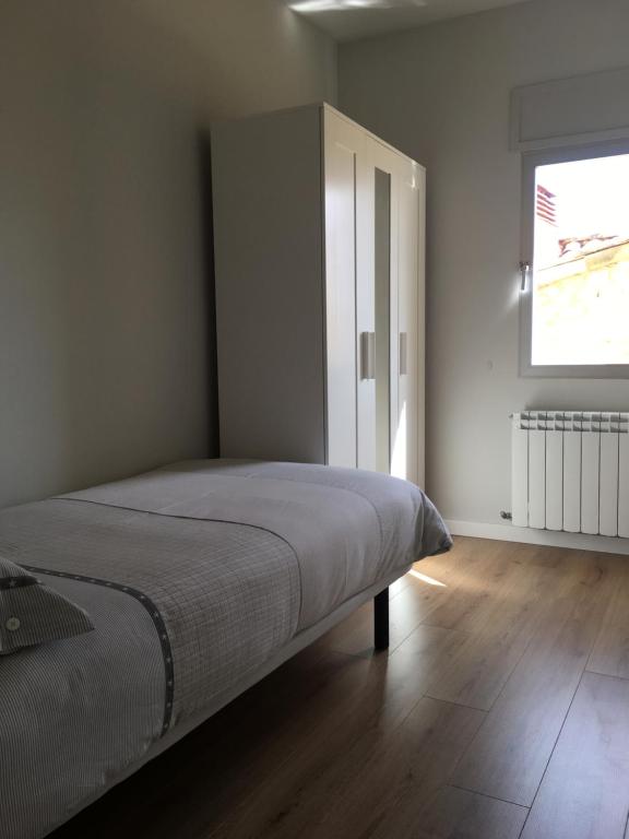Postel nebo postele na pokoji v ubytování Apartaments La Pertusa 1r piso