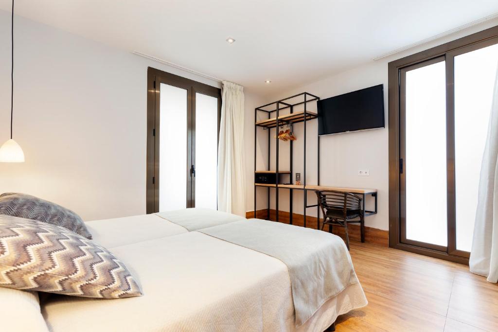 Postel nebo postele na pokoji v ubytování Hostal Fernando