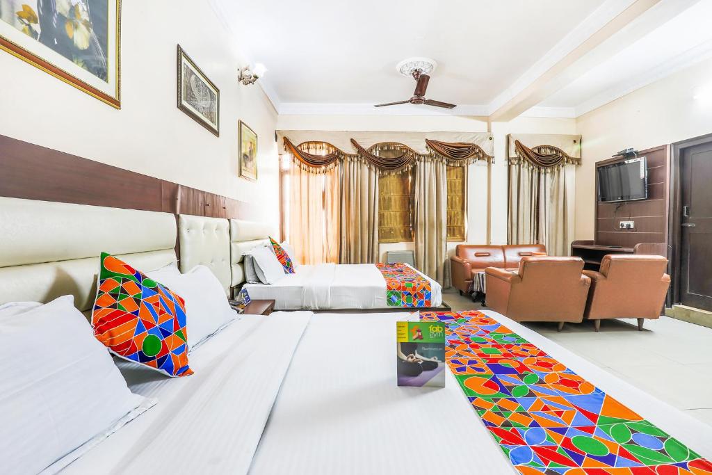 Postel nebo postele na pokoji v ubytování FabHotel Pramila Inn