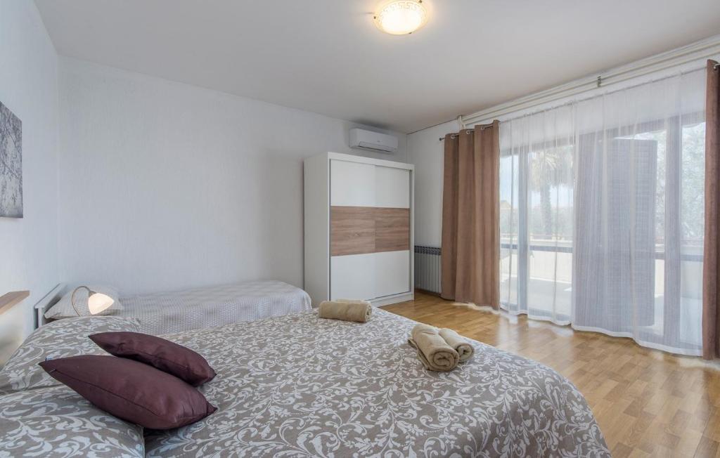 Postel nebo postele na pokoji v ubytování Koseto Tar