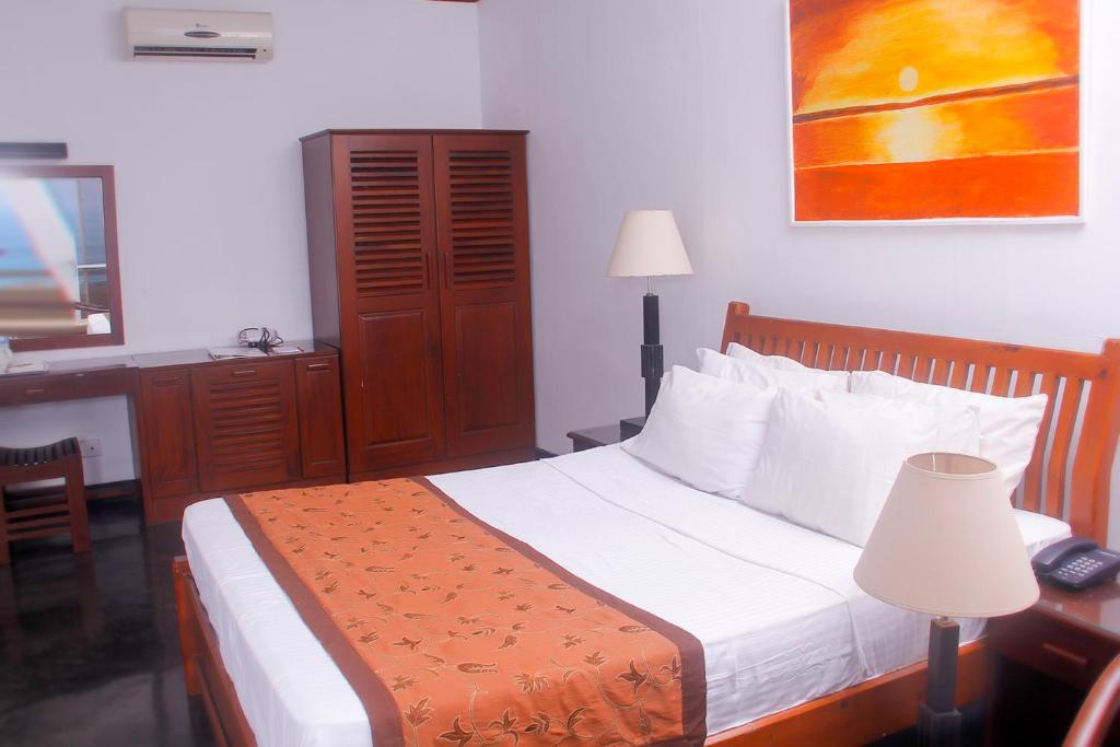 Postel nebo postele na pokoji v ubytování Sanmali Beach Hotel