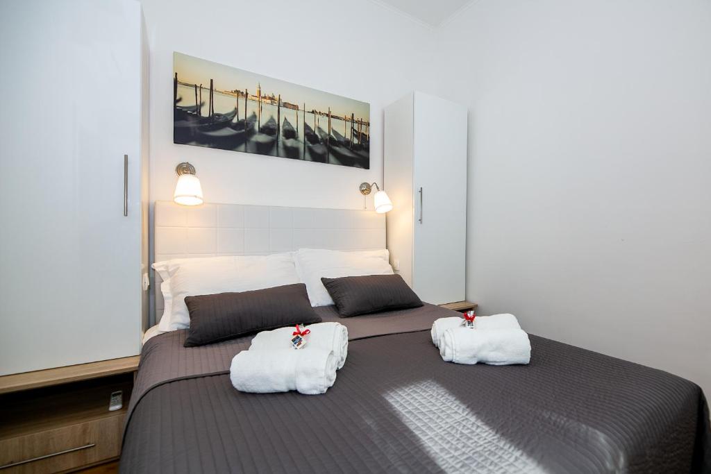 Posteľ alebo postele v izbe v ubytovaní Apartments Bella Fiume