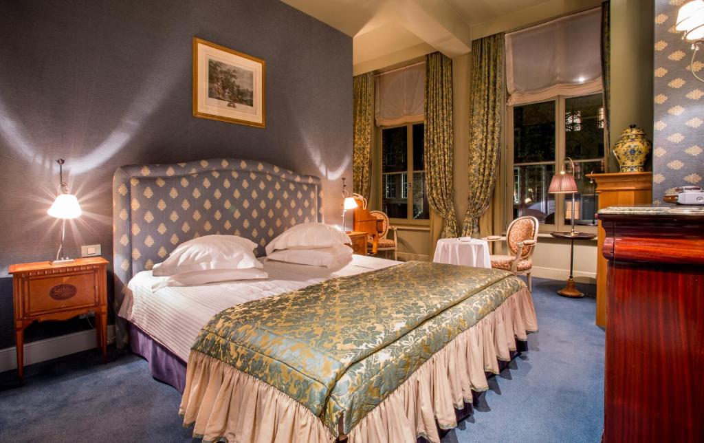Postel nebo postele na pokoji v ubytování Canal Suites