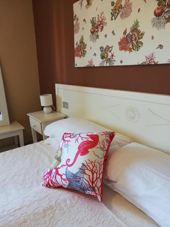 Postel nebo postele na pokoji v ubytování Hotel Frassetto