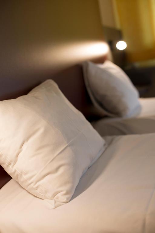 Postel nebo postele na pokoji v ubytování Mape hôtel