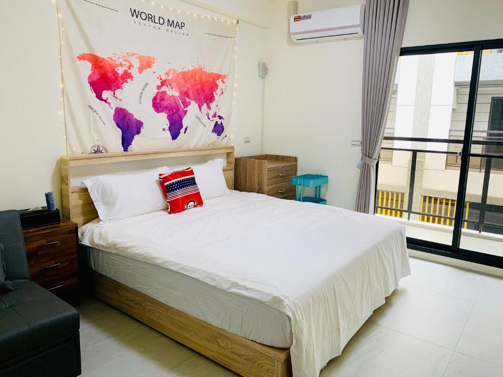 Postel nebo postele na pokoji v ubytování Mei Jia Guesthouse