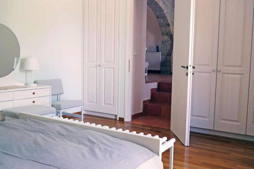 A bed or beds in a room at Apollo Beach House