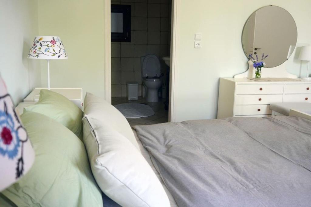 A bed or beds in a room at Apollo Beach House