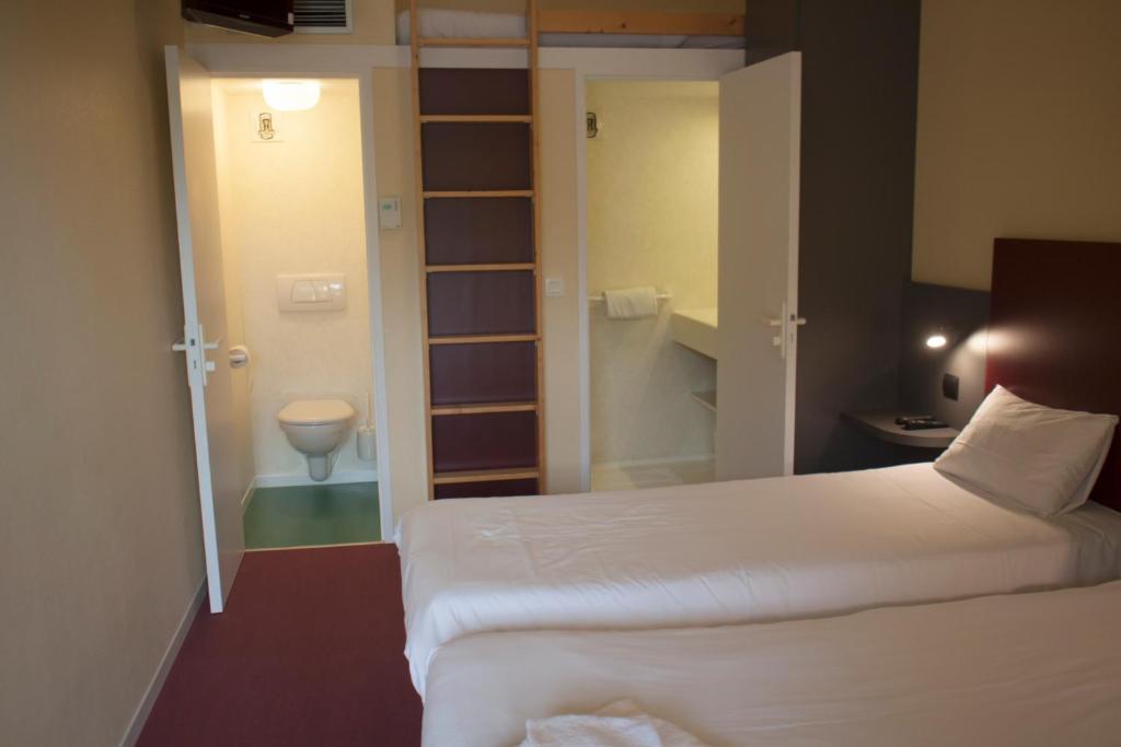 Postel nebo postele na pokoji v ubytování Mape hôtel