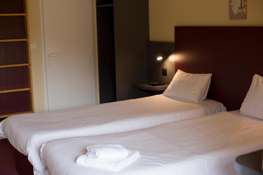 Postel nebo postele na pokoji v ubytování Mape hôtel