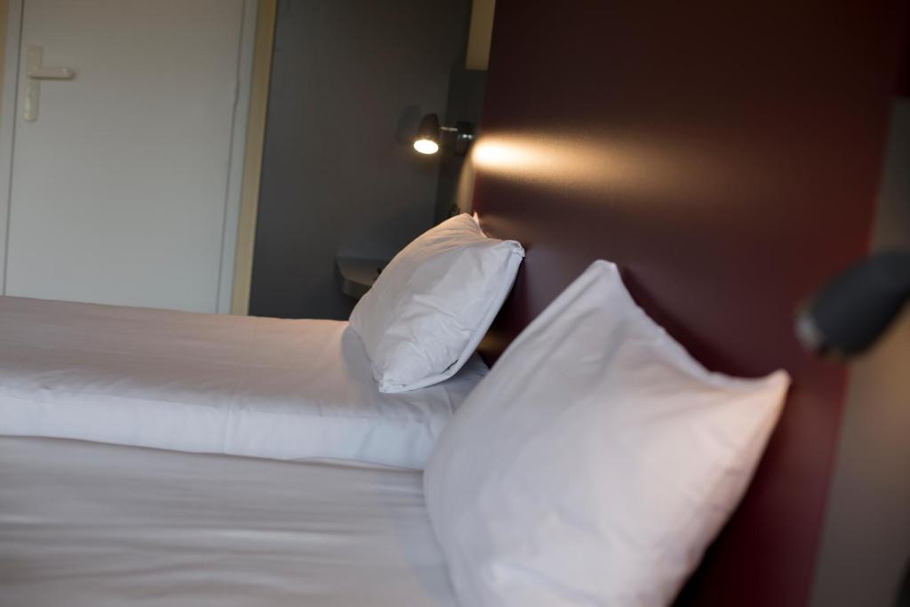 Postel nebo postele na pokoji v ubytování Mape hôtel