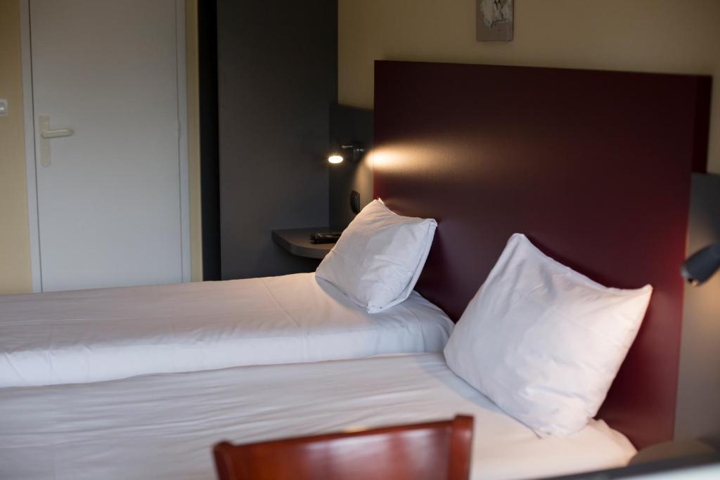 Postel nebo postele na pokoji v ubytování Mape hôtel