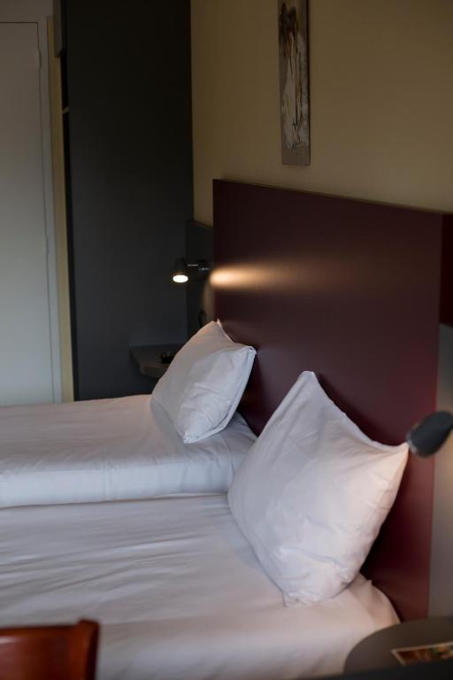 Postel nebo postele na pokoji v ubytování Mape hôtel