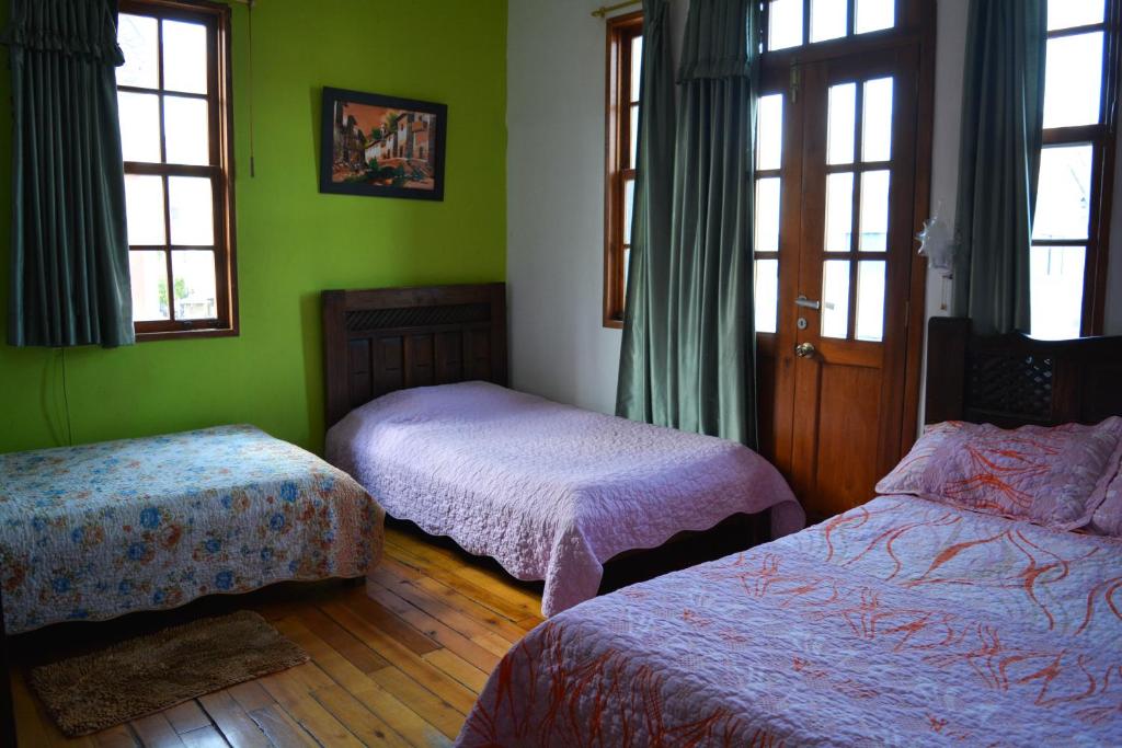 Postel nebo postele na pokoji v ubytování Hostal del Piamonte