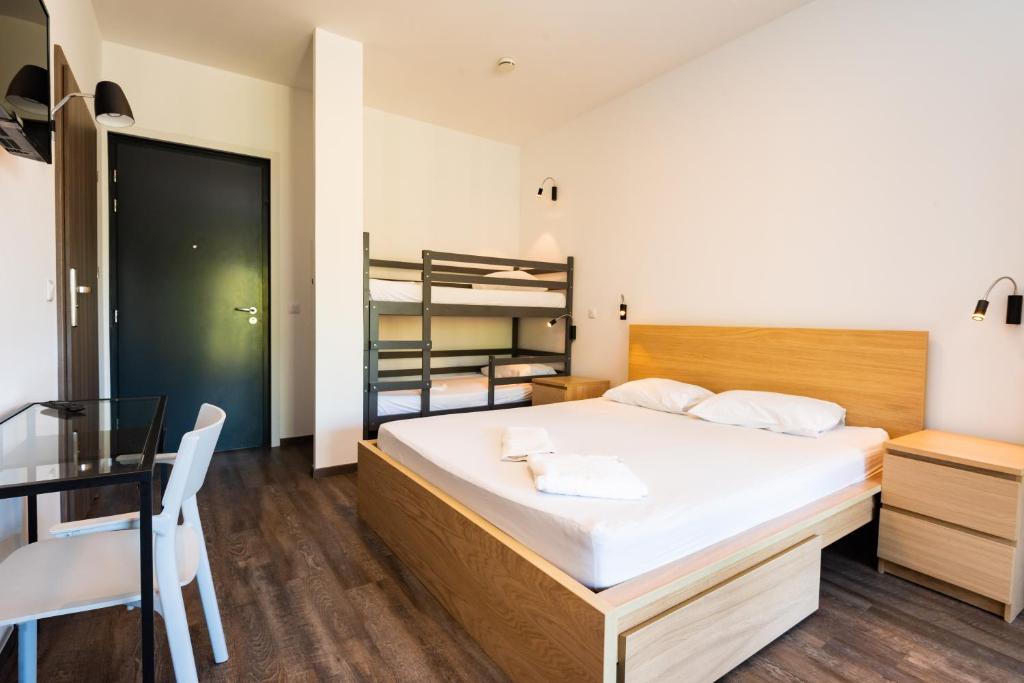 Postel nebo postele na pokoji v ubytování Le Village de la Pointe