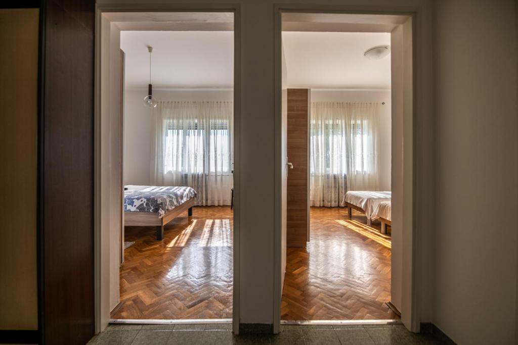 Postel nebo postele na pokoji v ubytování Apartment Nono
