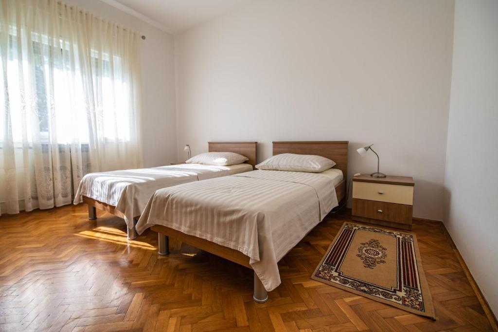 Postel nebo postele na pokoji v ubytování Apartment Nono