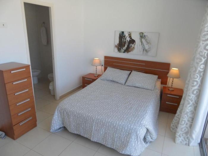 Posteľ alebo postele v izbe v ubytovaní DUPLEX C7 con PISCINA PRIVADA