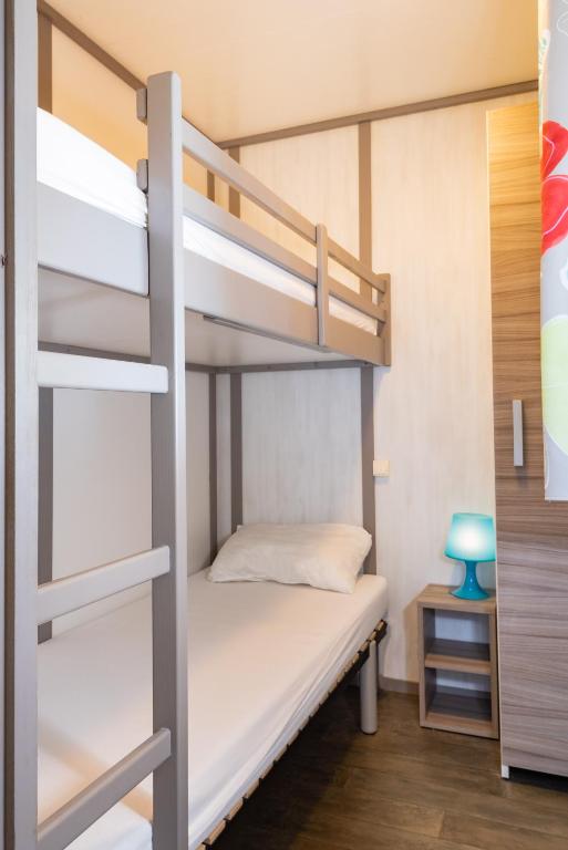 Postel nebo postele na pokoji v ubytování Le Village de la Pointe