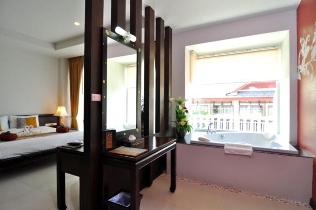 Postel nebo postele na pokoji v ubytování Baan Karonburi Resort